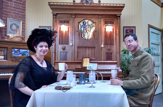 Diners enjoying their evening at Orchestria Palm Court surrounded by antique mechanical music machines